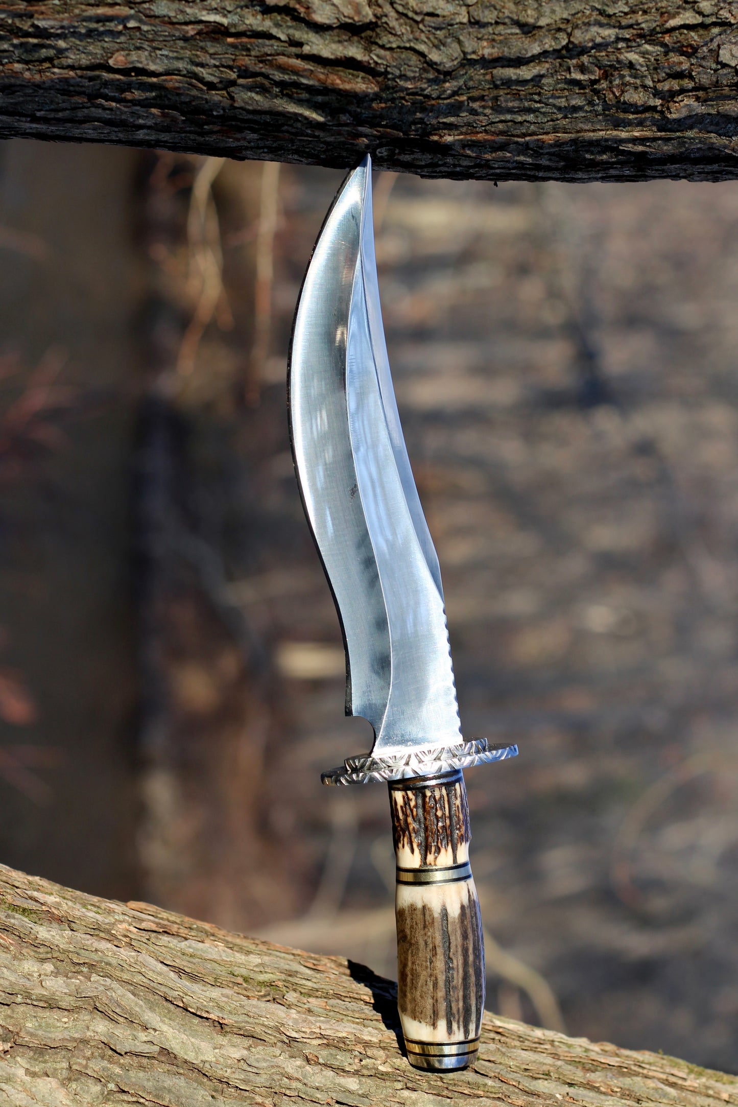 Stingmarrow’s Handcrafted Stainless Steel Hunting Knife with Genuine Deer Antler molded into an exclusive handle.